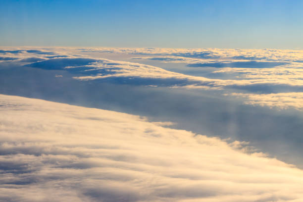 istock Beautiful white clouds in blue sky. View from airplane 1129071099