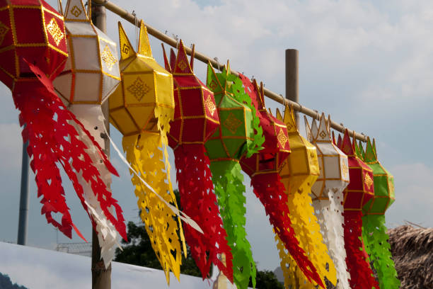 istock Row of colorful paper lanterns hanging on a bamboo stick 1129075641