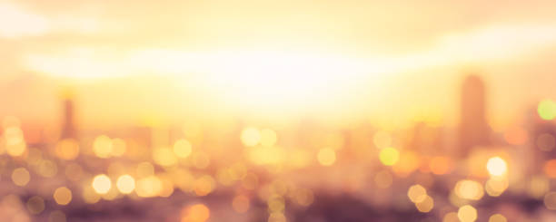 Summer sun blur golden hour sky sunset with city rooftop view  background cityscape office building landscape blurry urban lights skyline bokeh for evening party Summer sun blur golden hour sky sunset with city rooftop view  background cityscape office building landscape blurry urban lights skyline bokeh for evening party june photos stock pictures, royalty-free photos & images
