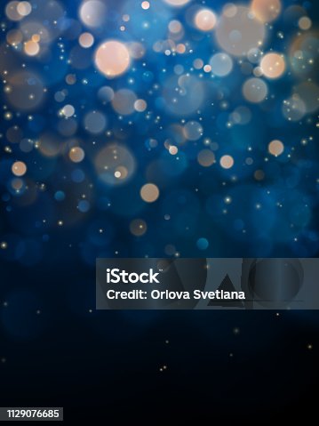istock Blurred bokeh light on dark blue background. Christmas and New Year holidays template. Abstract glitter defocused blinking stars and sparks. EPS 10 1129076685