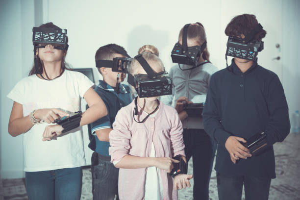 istock Children play virtual quest room 1129078212