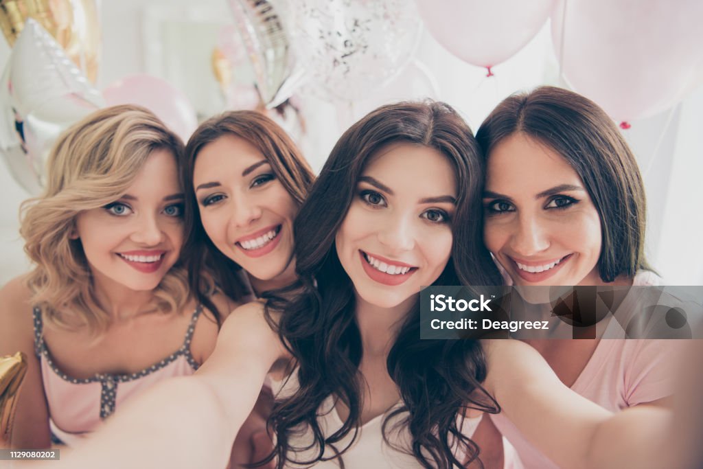 Self-portrait of nice-looking cute adorable winsome lovely attractive charming cheerful cheery girlfriends having fun in light white interior decorated house indoors Selfie Stock Photo