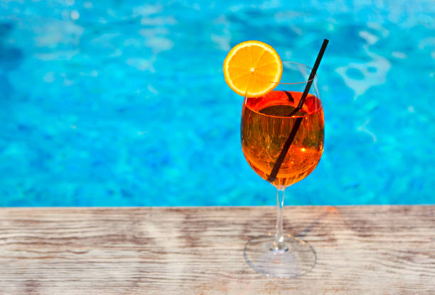 istock Glass of Spritz cocktail by the pool 1129081607