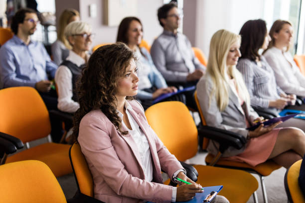istock Business people attending a seminar in board room. 1129082447