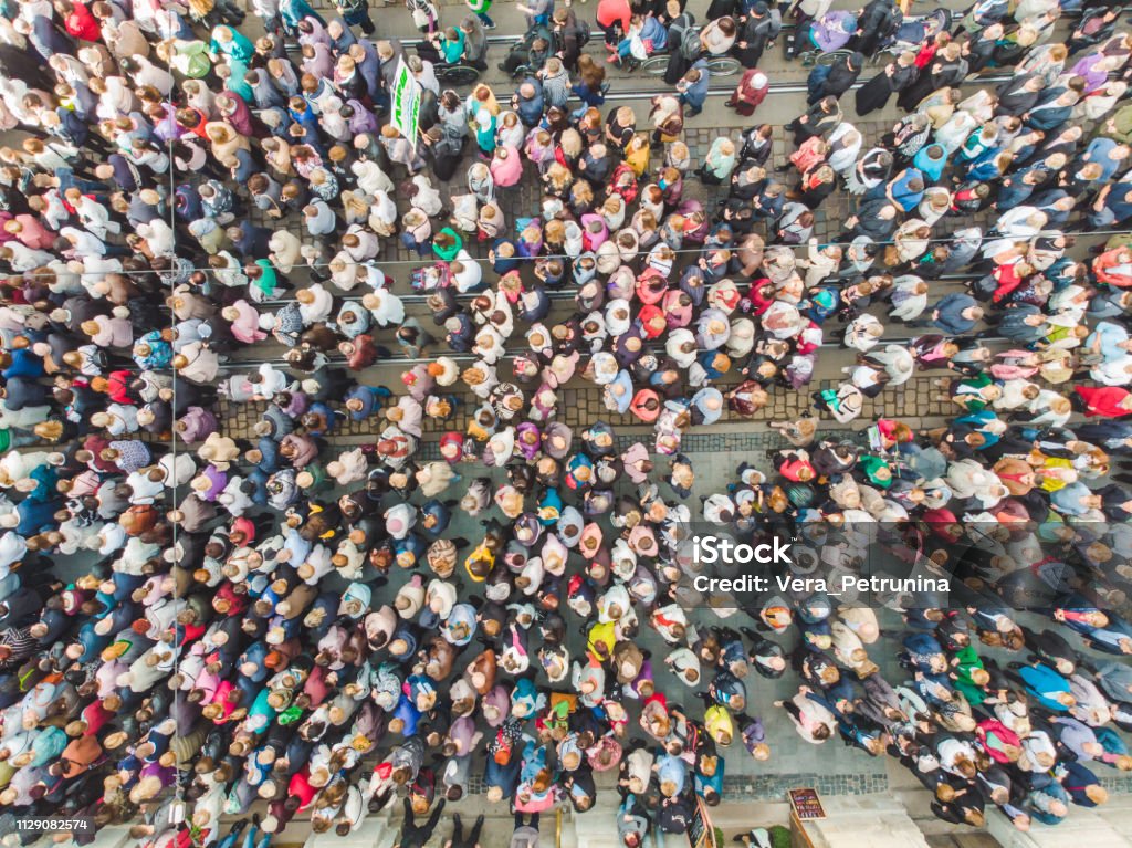 LVIV, UKRAINE - October 7, 2018: aerial view religious procession at city streets LVIV, UKRAINE - October 7, 2018: aerial view religious procession at city streets. nuns and monks People Stock Photo