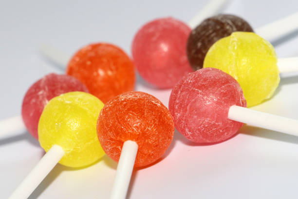 istock Sweet multicolored caramel on a stick. Sweets laid out on the table. 1129082694