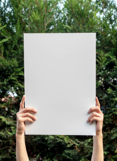 man holding up the poster,blank billboard