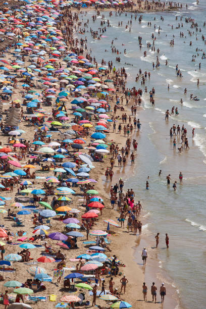 istock Mediterranean coastline in Spain. Calpe beach. Summer crowd. Alicante 1129084758