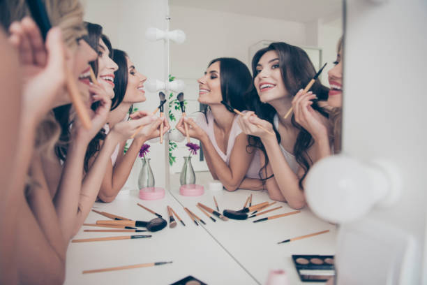 portrait of nice cute winsome attractive lovely well-groomed glamorous shine cheerful girlfriends having fun blush blusher in light white interior decorated house indoors - bachelorette party imagens e fotografias de stock