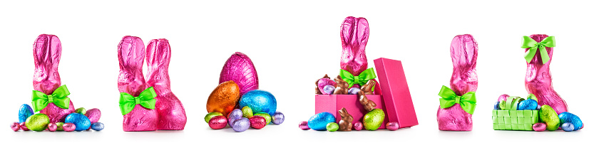 Chocolate easter eggs, rabbit with bow wrapped in pink foil, bunnies and colorful candies collection isolated on white background. Design elements banner, holiday and springtime theme