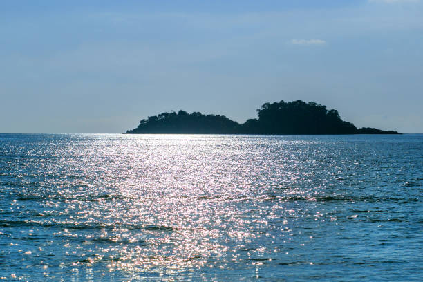 istock Beautiful tropical island at sunset 1129088078