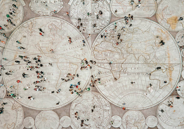 Crowd walking on global map Crowd walking on global map. Composition made with antique map from 1779. Image was taken with a Sony Alpha A7RIII and made a composition with an image taken with a Mavic Pro I with Photoshop. citizenship stock pictures, royalty-free photos & images