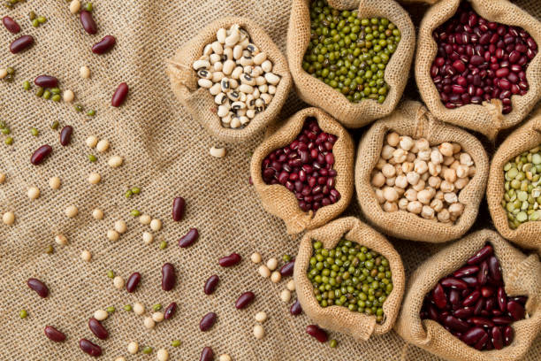istock Different type of Bean seeds in sack bag, top view 1129090415