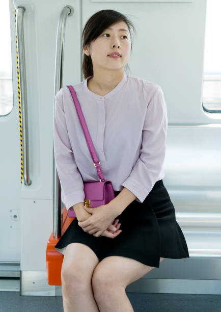 istock Woman sitting in the subway train 1129091843