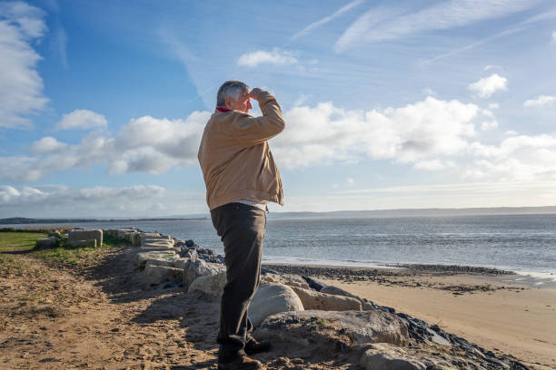 istock Senior Caucasian man on beach 1129091876