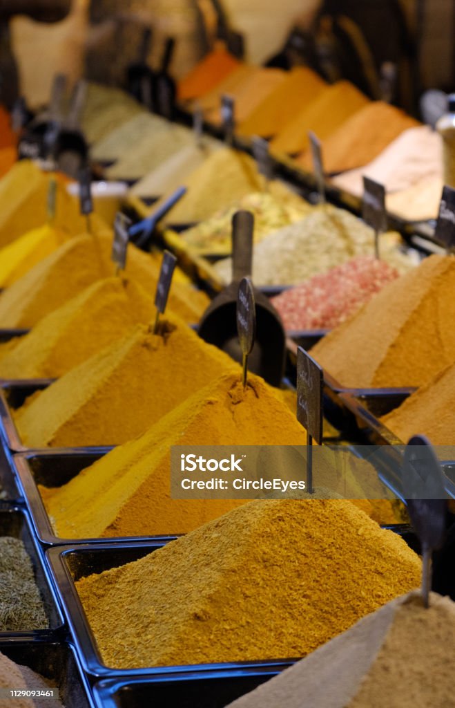 Traditional spices market stall A variety of colored spices powders on a market Africa Stock Photo