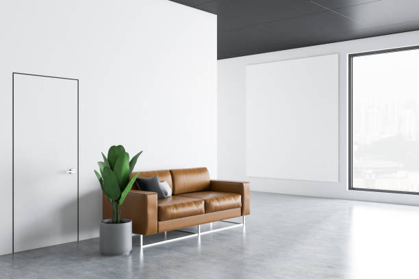 istock White office waiting room with poster, side view 1129093739