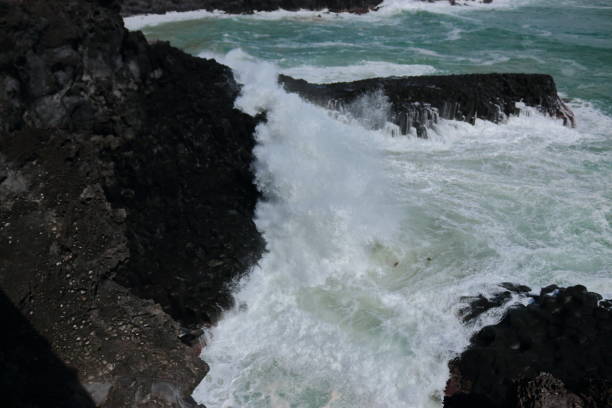 istock Cannon-dong main seungyeoli, waves, volcanic rock, dosing pillars, 1129093857