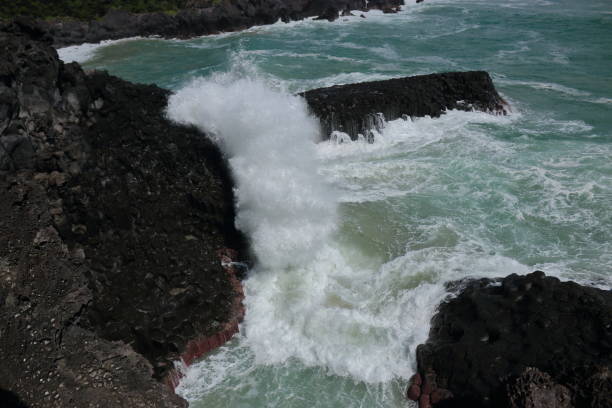 istock Cannon-dong main seungyeoli, waves, volcanic rock, dosing pillars, 1129093869