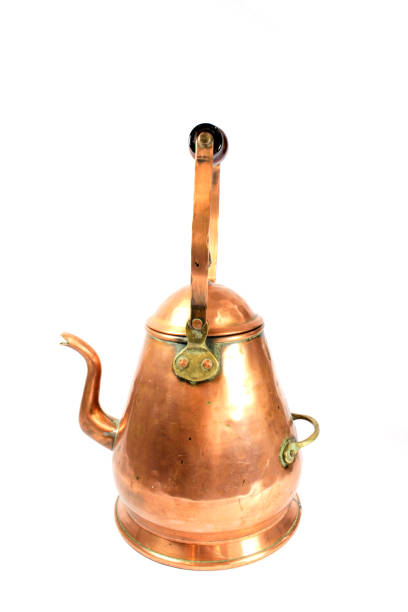 istock Brass Copper tea Pot Kettle on White Background 1129094303