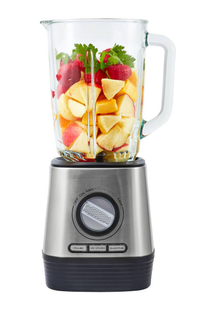 Stationary blender with fruit Stationary blender filled with slices of apples, pumpkins, strawberries for making smoothie. blender photos stock pictures, royalty-free photos & images