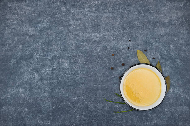 istock Homemade broth in the bowl on the  grey background. 1129094883