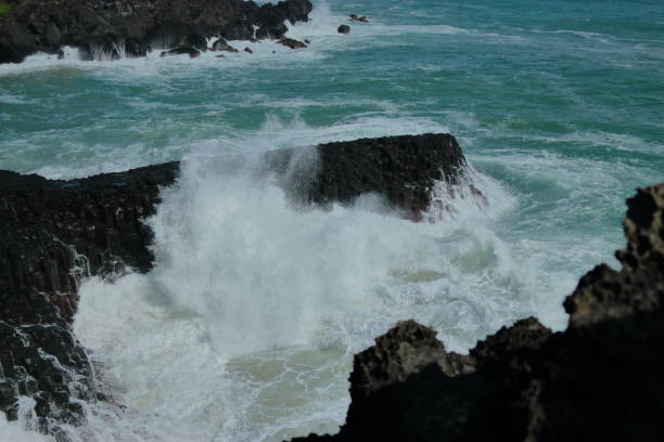 istock Cannon-dong main seungyeoli, waves, volcanic rock, dosing pillars, 1129095249
