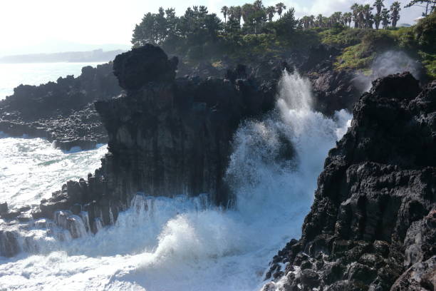 istock Cannon-dong main seungyeoli, waves, volcanic rock, dosing pillars, 1129095444