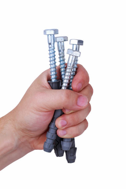 istock construction dowels in male hand 1129095563