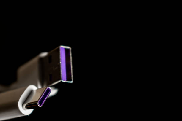 Closeup of USB cable. Isolated on black background