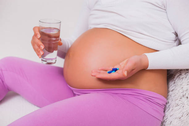 istock Pregnant woman is having cold 1129097522