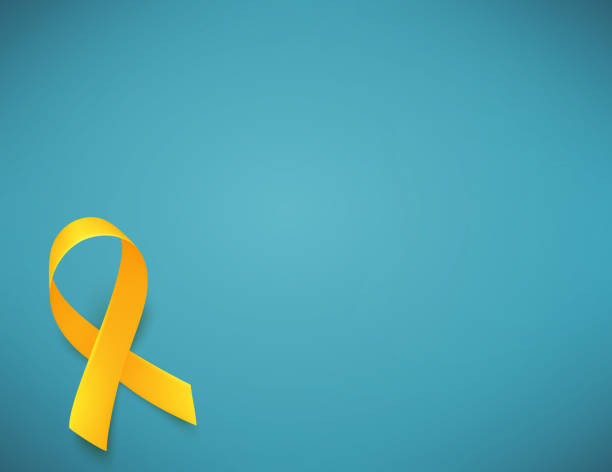 istock Background with realistic yellow ribbon. World childhood cancer awareness symbol, vector illustration. 1129097722