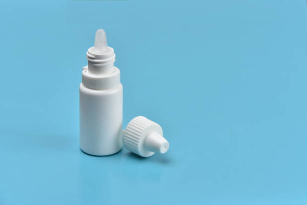 Medical bottle for eye drops Medical bottle for eye drops eyedropper stock pictures, royalty-free photos & images