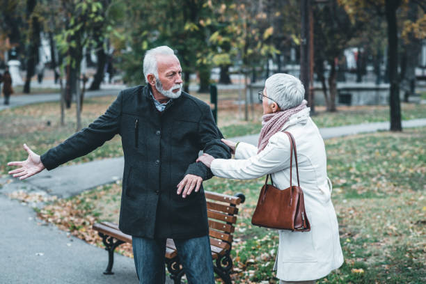 istock Mature Couple Having a Debate in the Public Park 1129098058