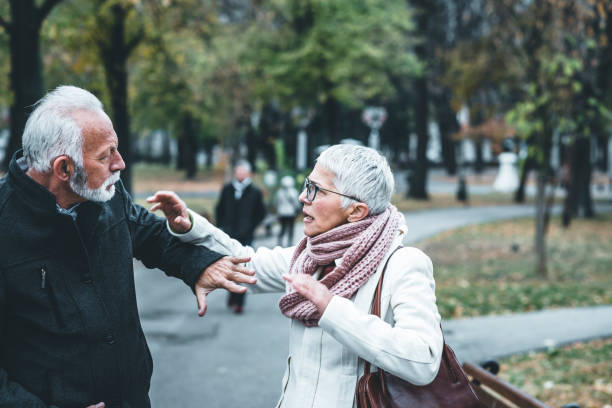 istock Mature Couple Having a Debate in the Public Park 1129098110