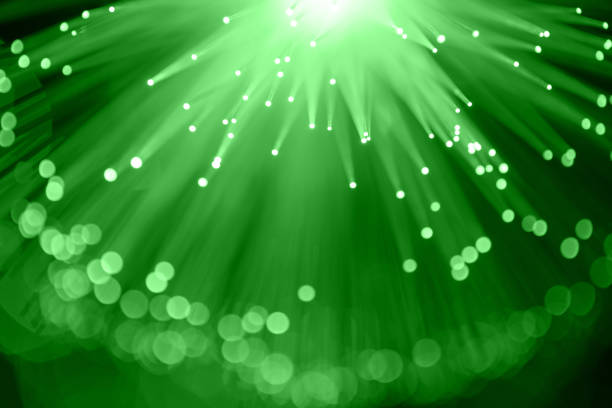 istock Fiber optics abstract background with defocused lights (green) 1129098223