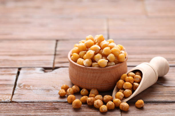 istock Roasted and dry chickpeas on brown wooden table 1129101581