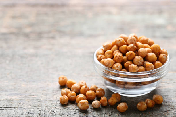 istock Roasted chickpeas in bowl on gray wooden table 1129101778