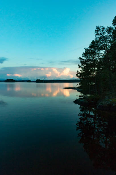 istock Sunset over a calm lake in Sweden during a summer evening 1129101802