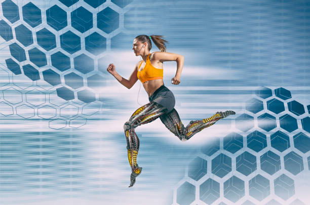 beautiful female athlete with artificial robotic legs running fast - muscle build imagens e fotografias de stock