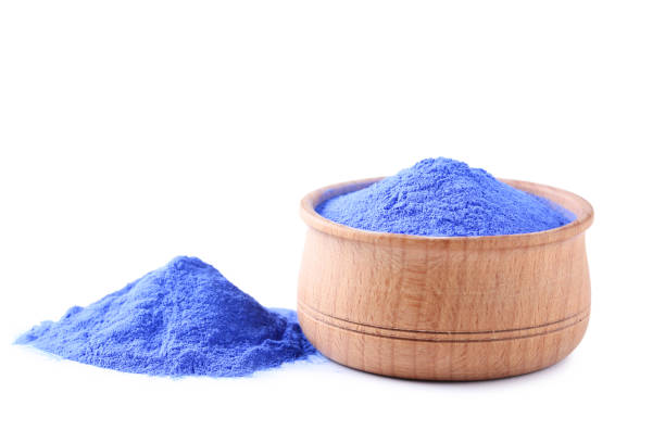 istock Holi powder in bowl isolated on white background 1129101996