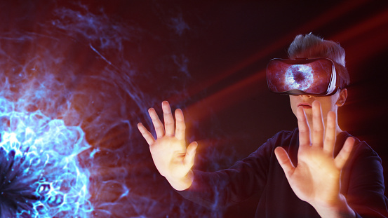Young man wearing VR headset. Discovering magical sparks of pulsar. ASMR experience.