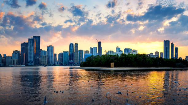 Beautiful sunset over emirate of Sharjah skyline Beautiful sunset over emirate of Sharjah skyline in the United Arab Emirates sharjah city stock pictures, royalty-free photos & images