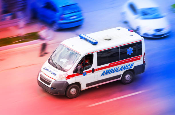 istock Ambulance van on highway with flashing lights 1129106047