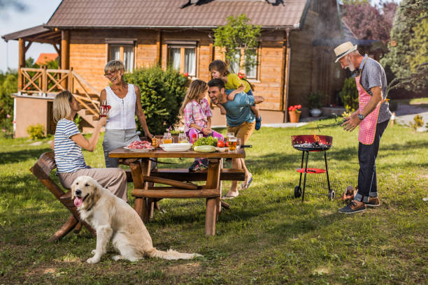istock Happy multi-generation family having fun during barbecue time outdoors. 1129108025