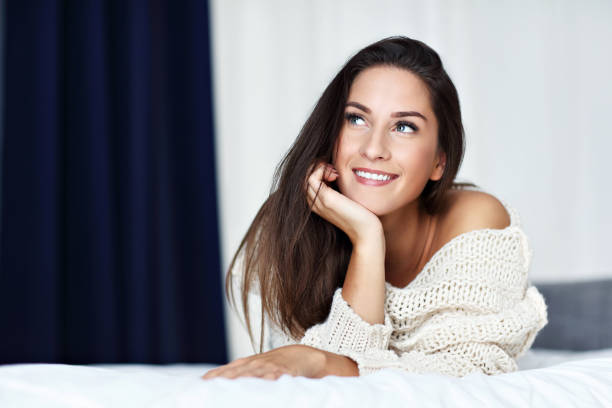 istock Young beautiful woman resting in bed 1129108617