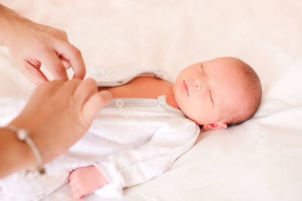 istock Woman undress child 1129110271
