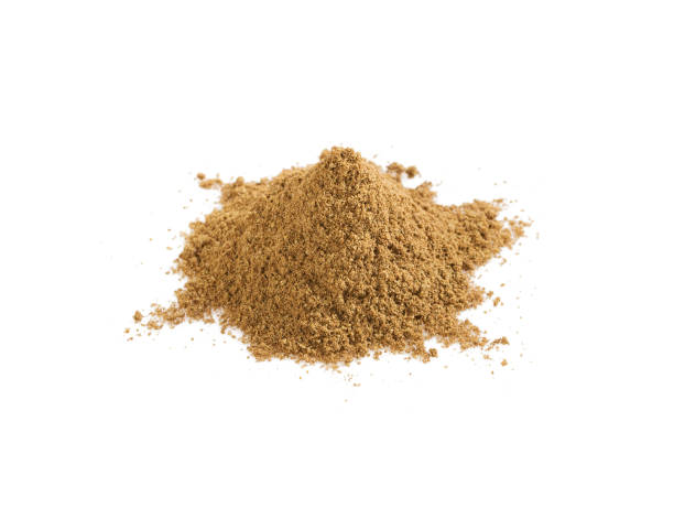 istock Pile of cumin powder isolated on white 1129112098