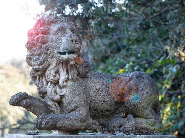 istock Proud stone lion staring majestically 1129113222