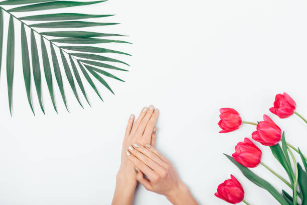 istock Female's hands rubbing cosmetic cream 1129113532